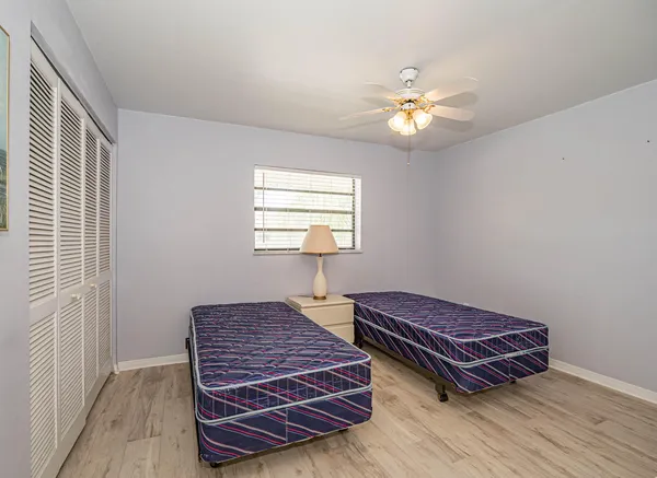 a living room with a balcony and wooden floor
