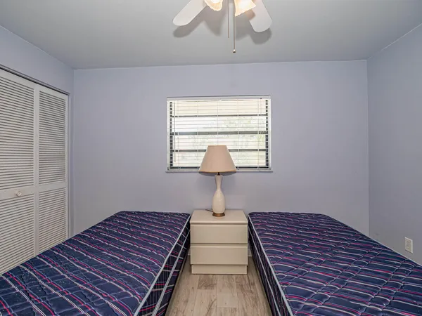 a bedroom with bed and a window