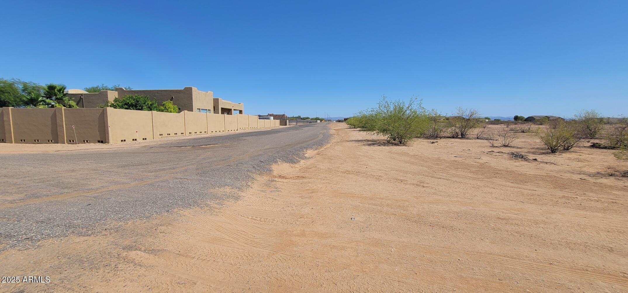 237-x-4 West Jomax Road, Unit 4 Wittmann, AZ 85361 - Photo 17 of 17 a view of a dry yard with a house