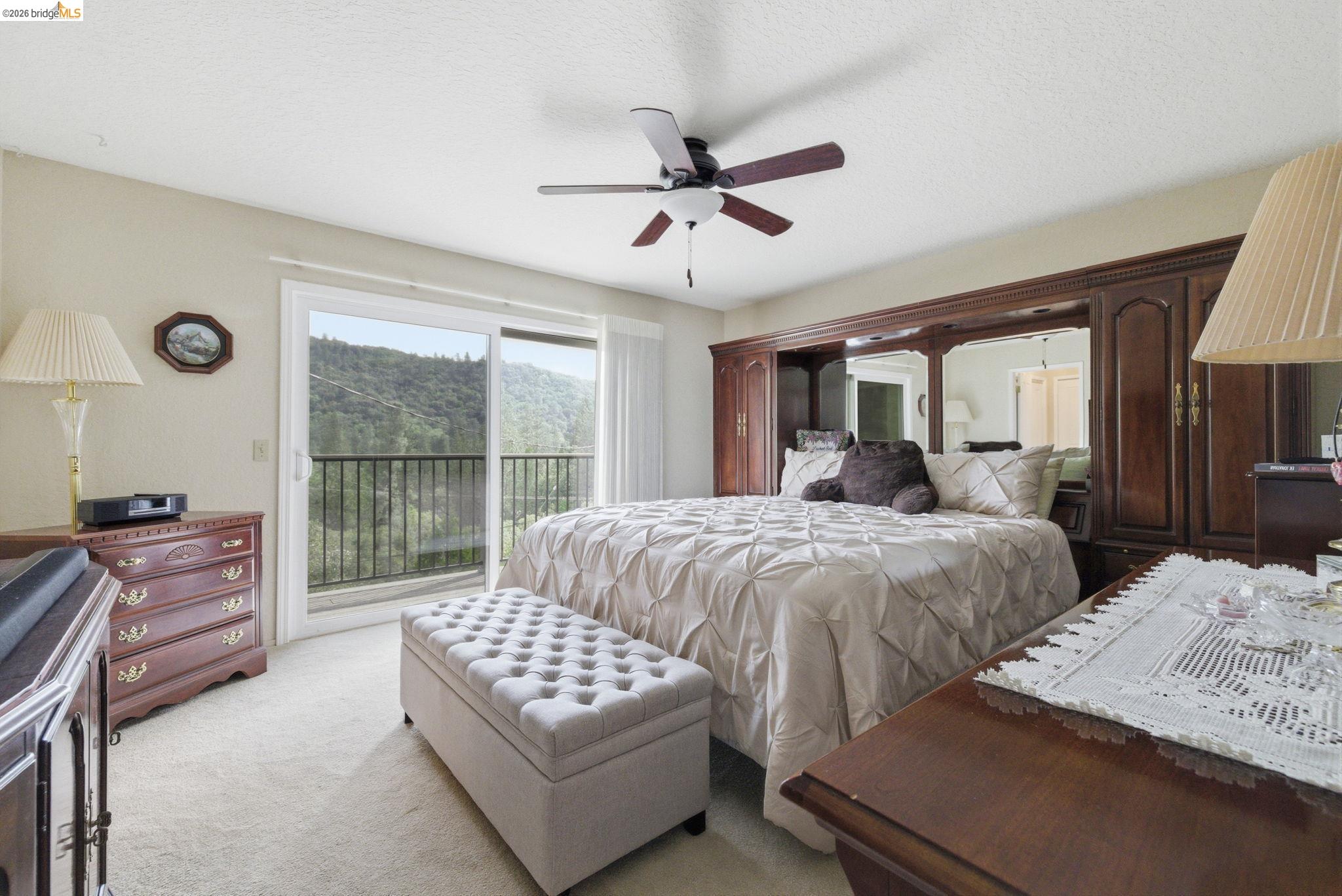 21955 Fallview Drive Sonora, CA 95370 - Photo 13 of 32 a bedroom with a bed and a large window