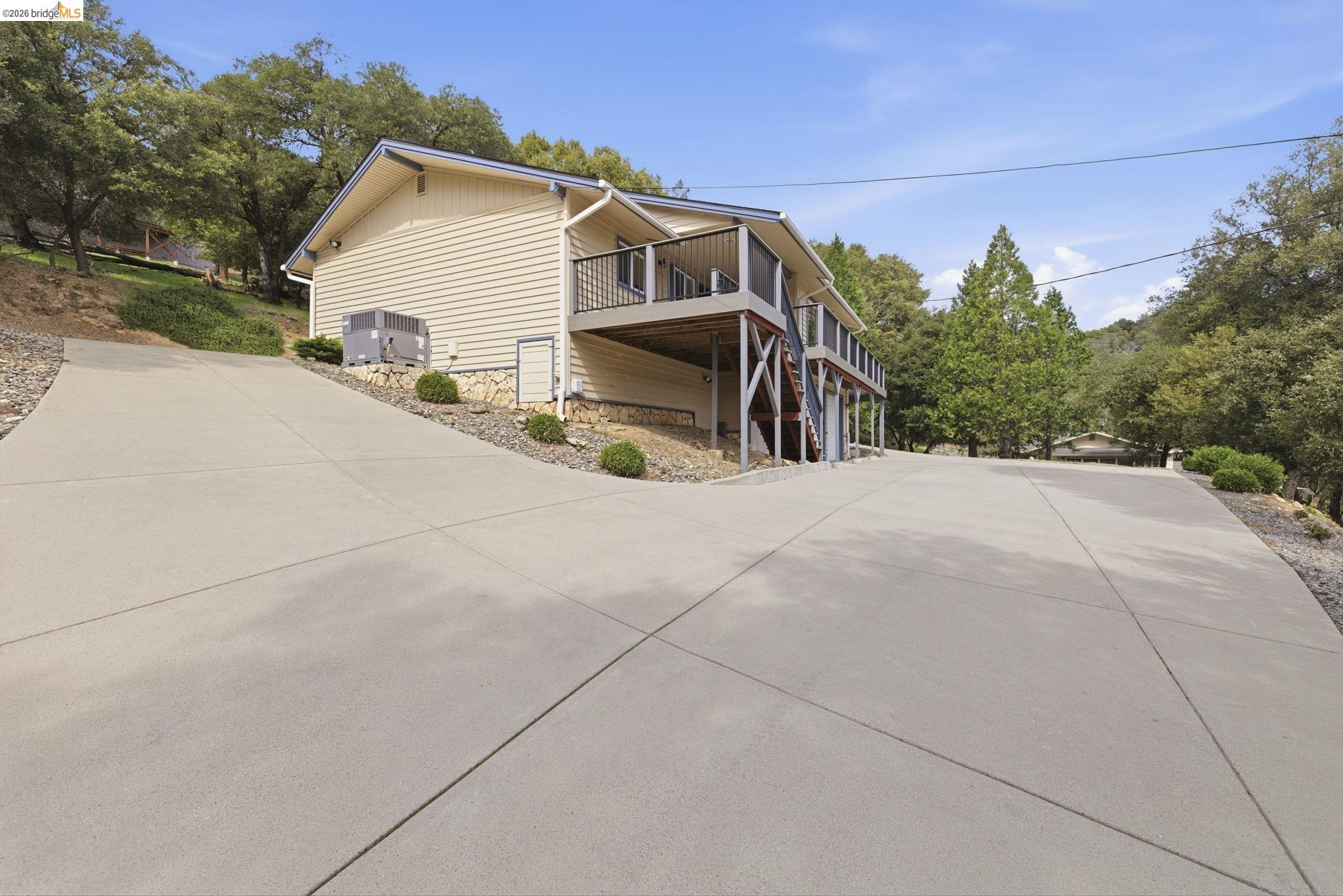 21955 Fallview Drive Sonora, CA 95370 - Photo 25 of 32 a view of a house with a garage