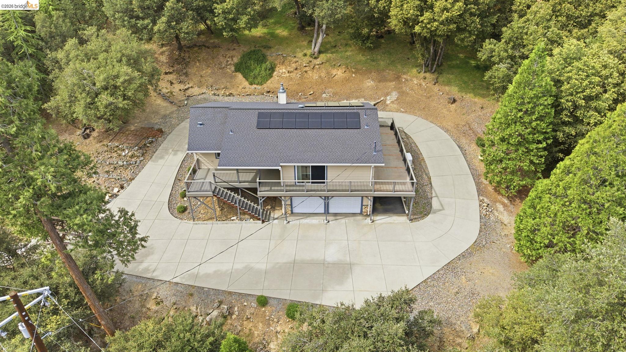 21955 Fallview Drive Sonora, CA 95370 - Photo 29 of 32 an aerial view of a house with a yard and lake view