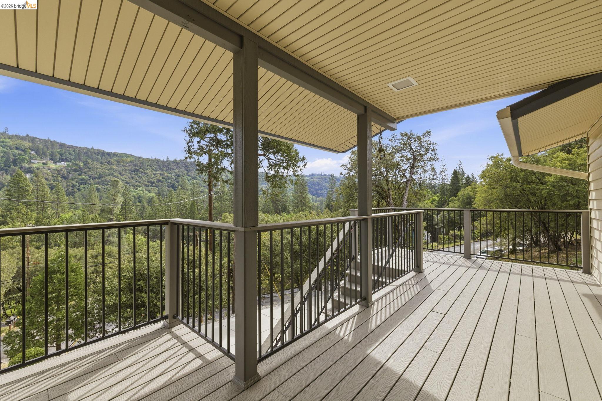 21955 Fallview Drive Sonora, CA 95370 - Photo 4 of 32 a view of a balcony with wooden floor and fence
