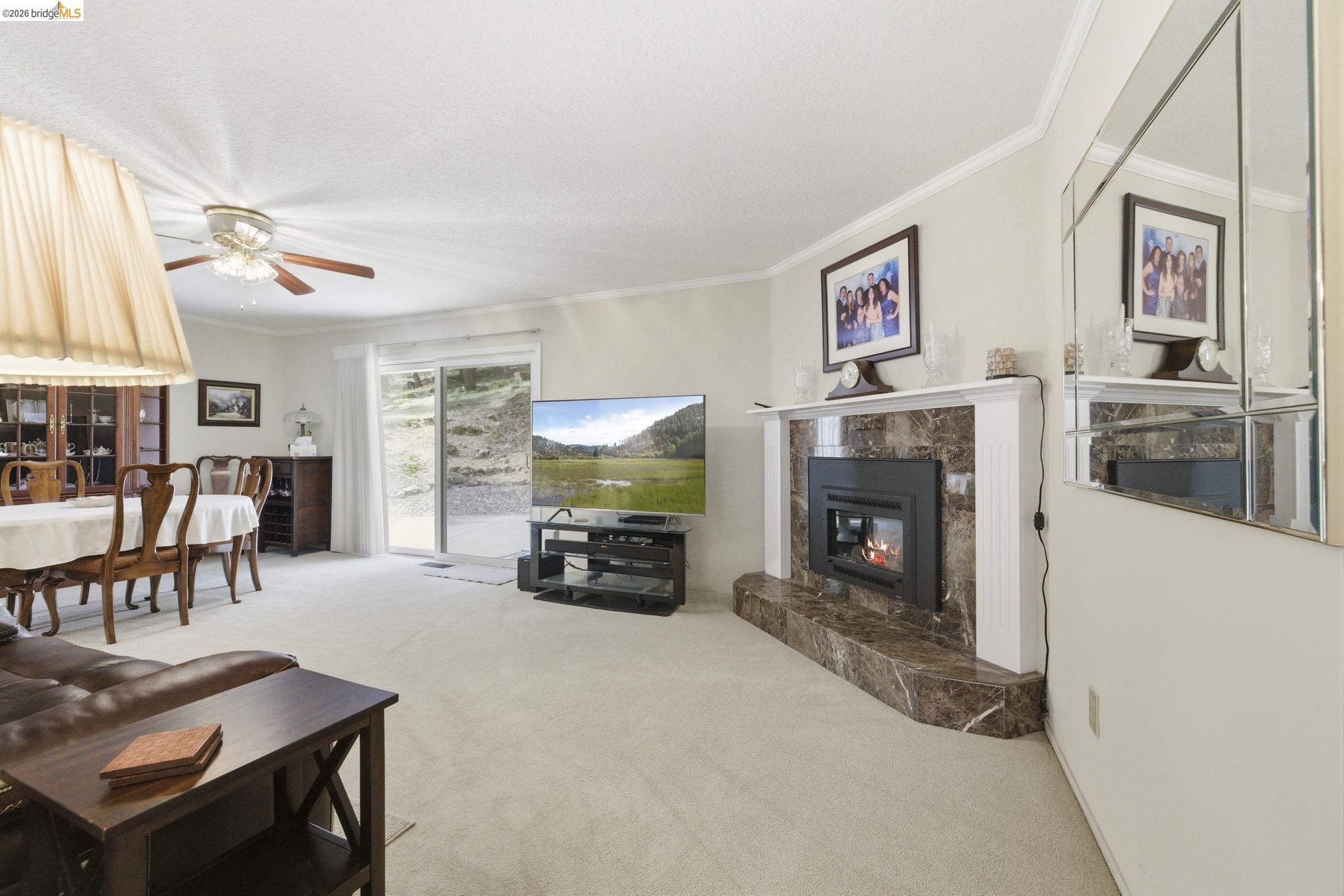 21955 Fallview Drive Sonora, CA 95370 - Photo 5 of 32 a living room with furniture and a fireplace