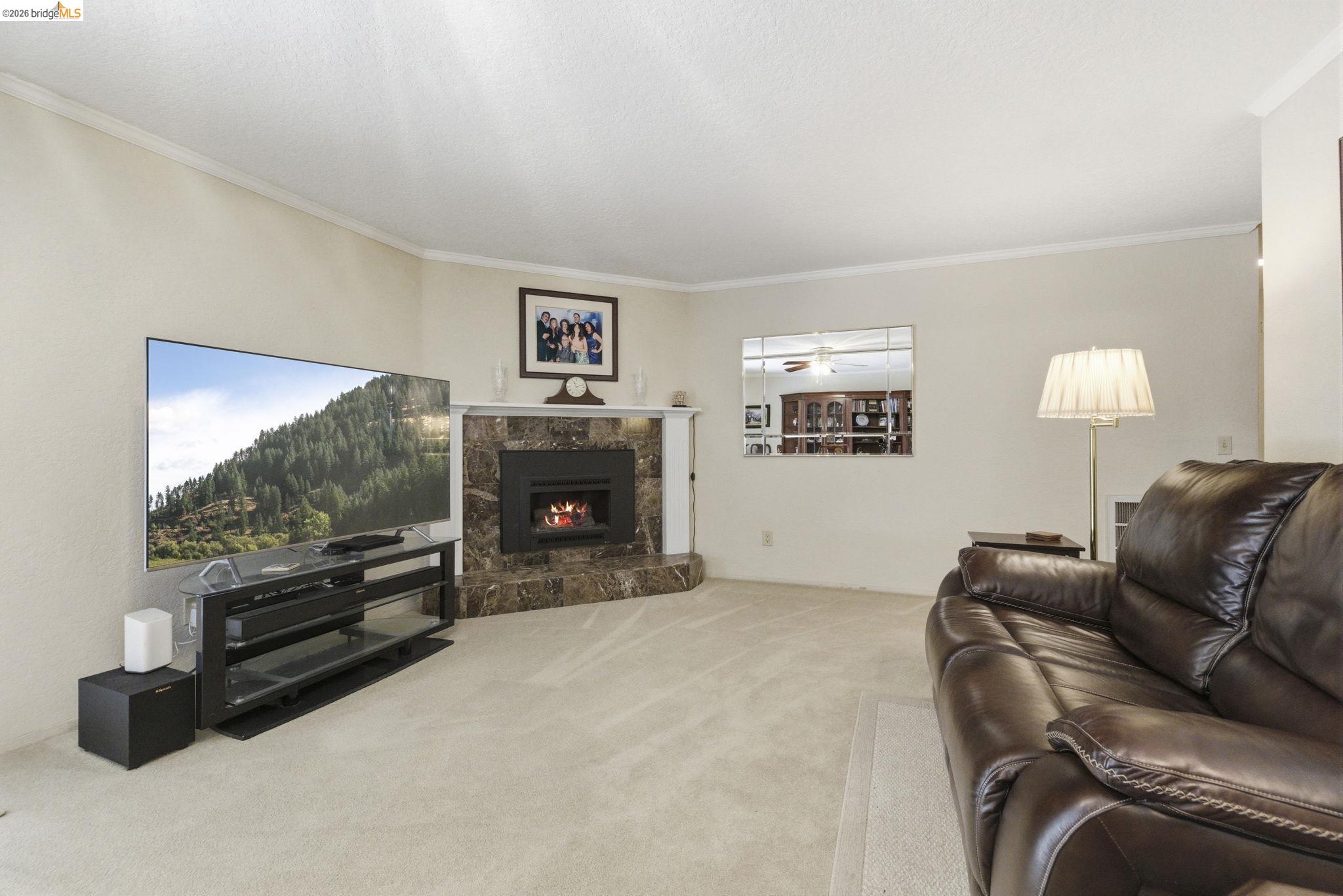 21955 Fallview Drive Sonora, CA 95370 - Photo 8 of 32 a living room with furniture and a flat screen tv