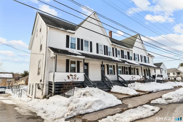 a view of a house with snow on roof