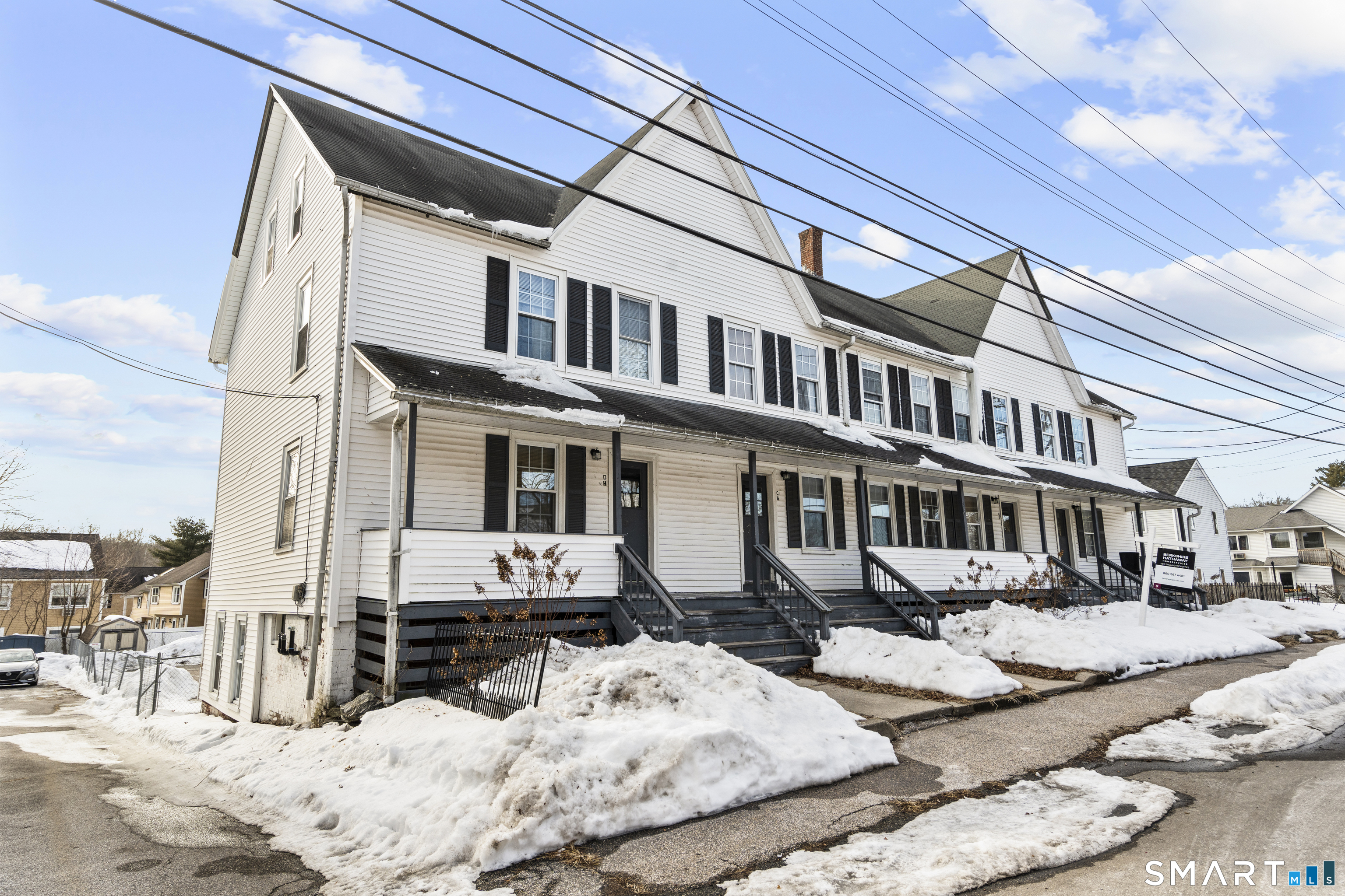 a view of a house with snow on roof
