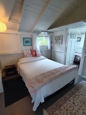 a bedroom with a bed and a closet