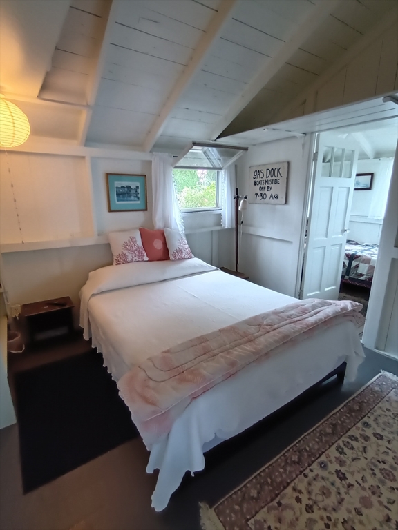 39 North Neck Road Edgartown, MA 02539 - Photo 11 of 26 a bedroom with a bed and a closet