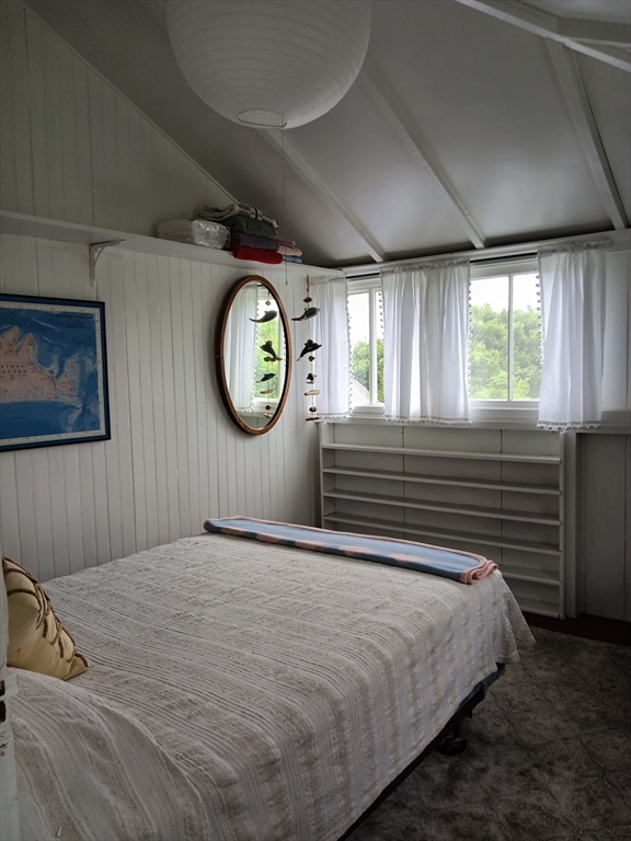 39 North Neck Road Edgartown, MA 02539 - Photo 12 of 26 a bedroom with a bed and a lamp on dresser next to a window