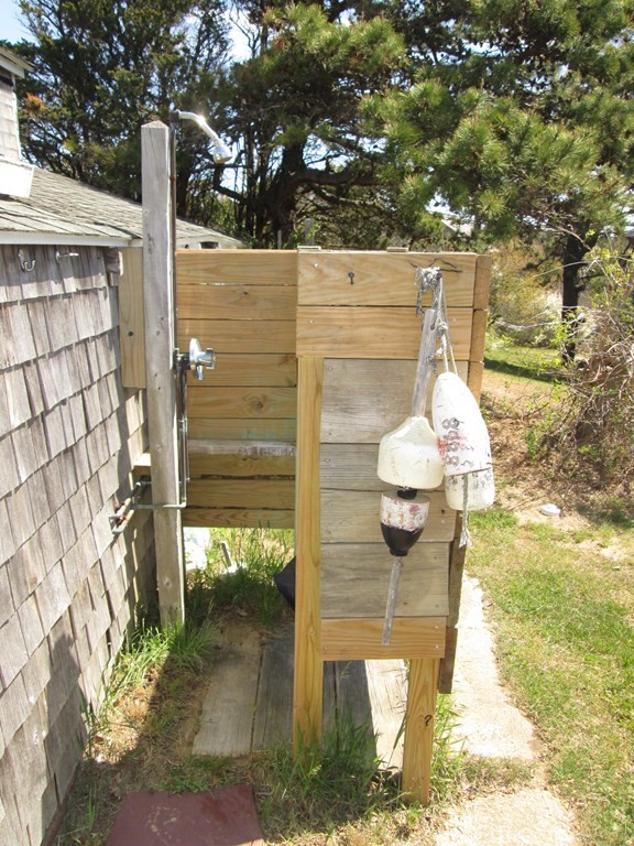 39 North Neck Road Edgartown, MA 02539 - Photo 20 of 26 a front view of a house with a yard