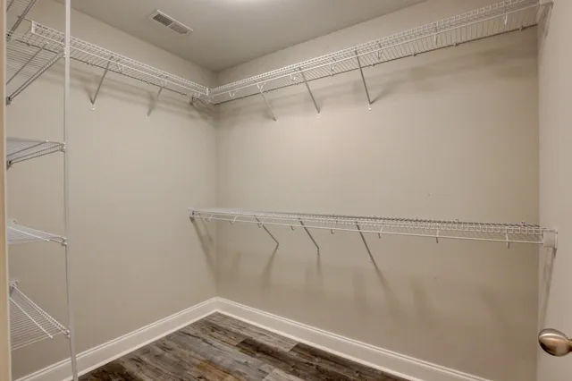 a view of a balcony with wooden floor