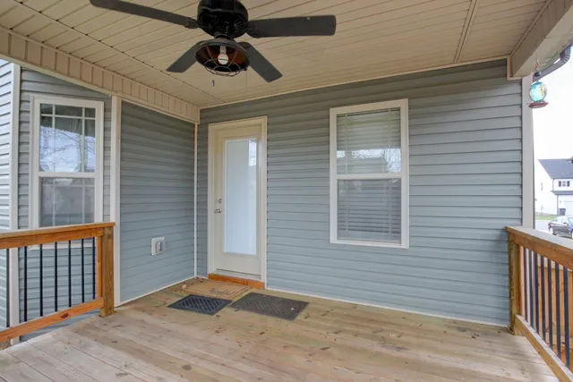 a large kitchen with a sink stainless steel appliances and cabinets