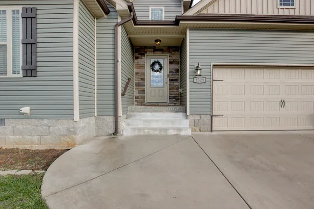 a front view of a house with garage