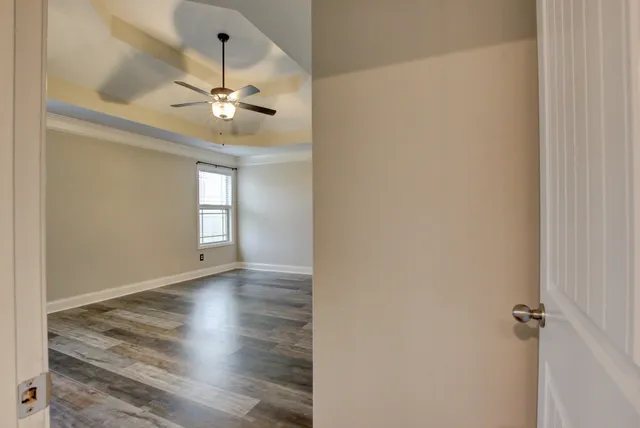 a view of livingroom with kitchen and hardwood floor