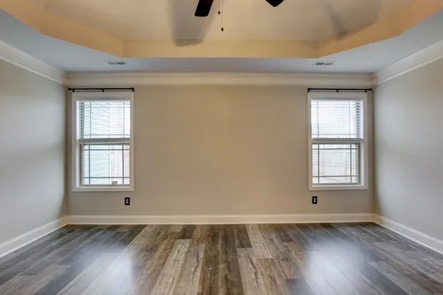 a view of an entryway with wooden floor