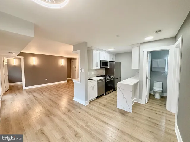a view of kitchen with wooden floor