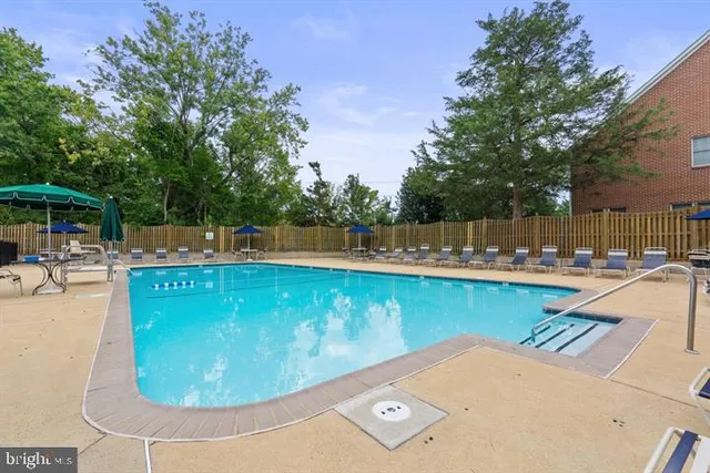 a view of a swimming pool with a patio