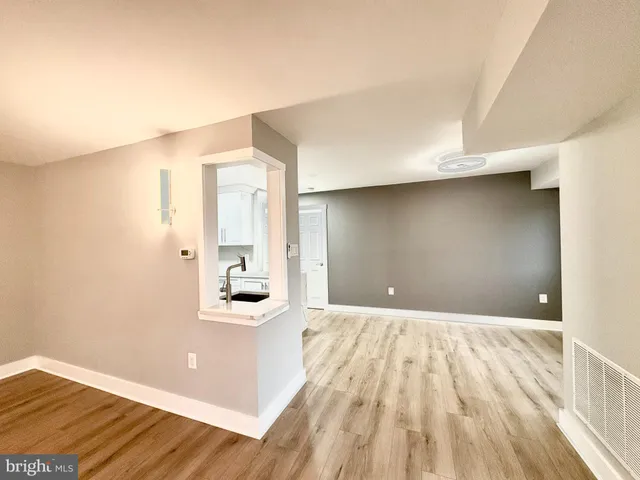 a view of a bathroom with sink and mirror