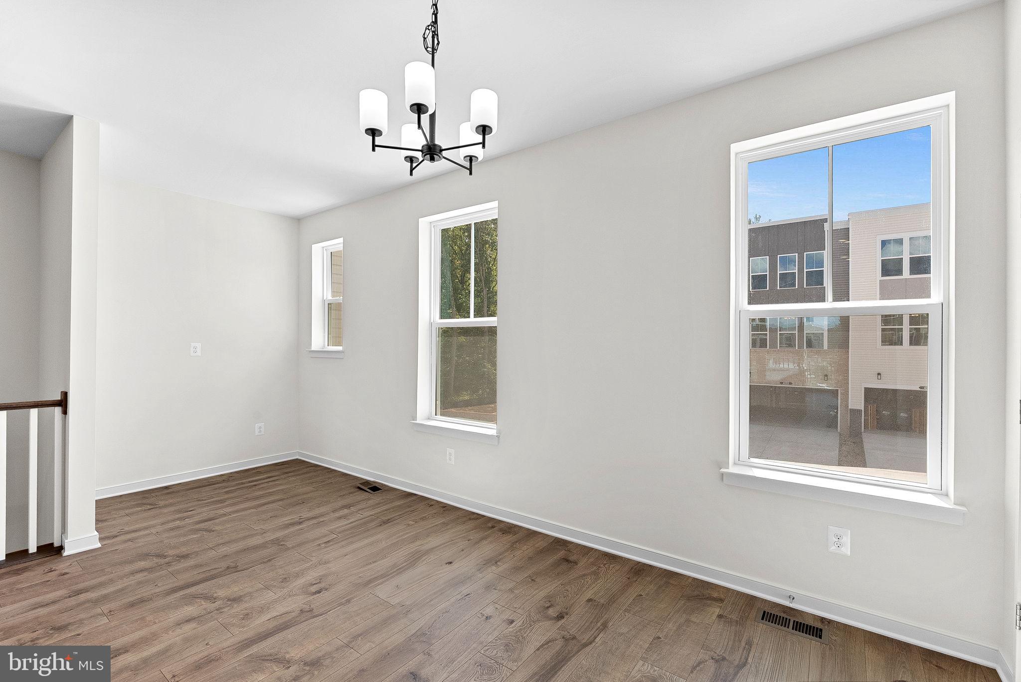 4151 Mountjoy Way Dumfries, VA 22026 - Photo 11 of 41 a view of empty room with wooden floor and fan