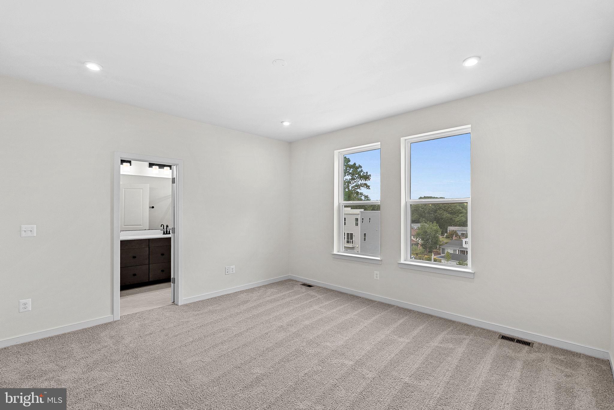 4151 Mountjoy Way Dumfries, VA 22026 - Photo 24 of 41 an empty room with windows and cabinet