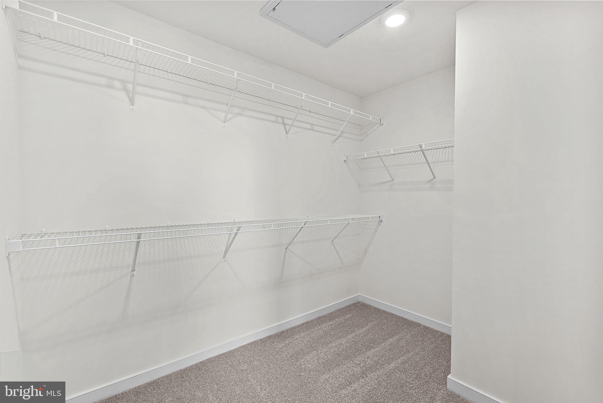 4151 Mountjoy Way Dumfries, VA 22026 - Photo 26 of 41 a view of a room with racks on the wall