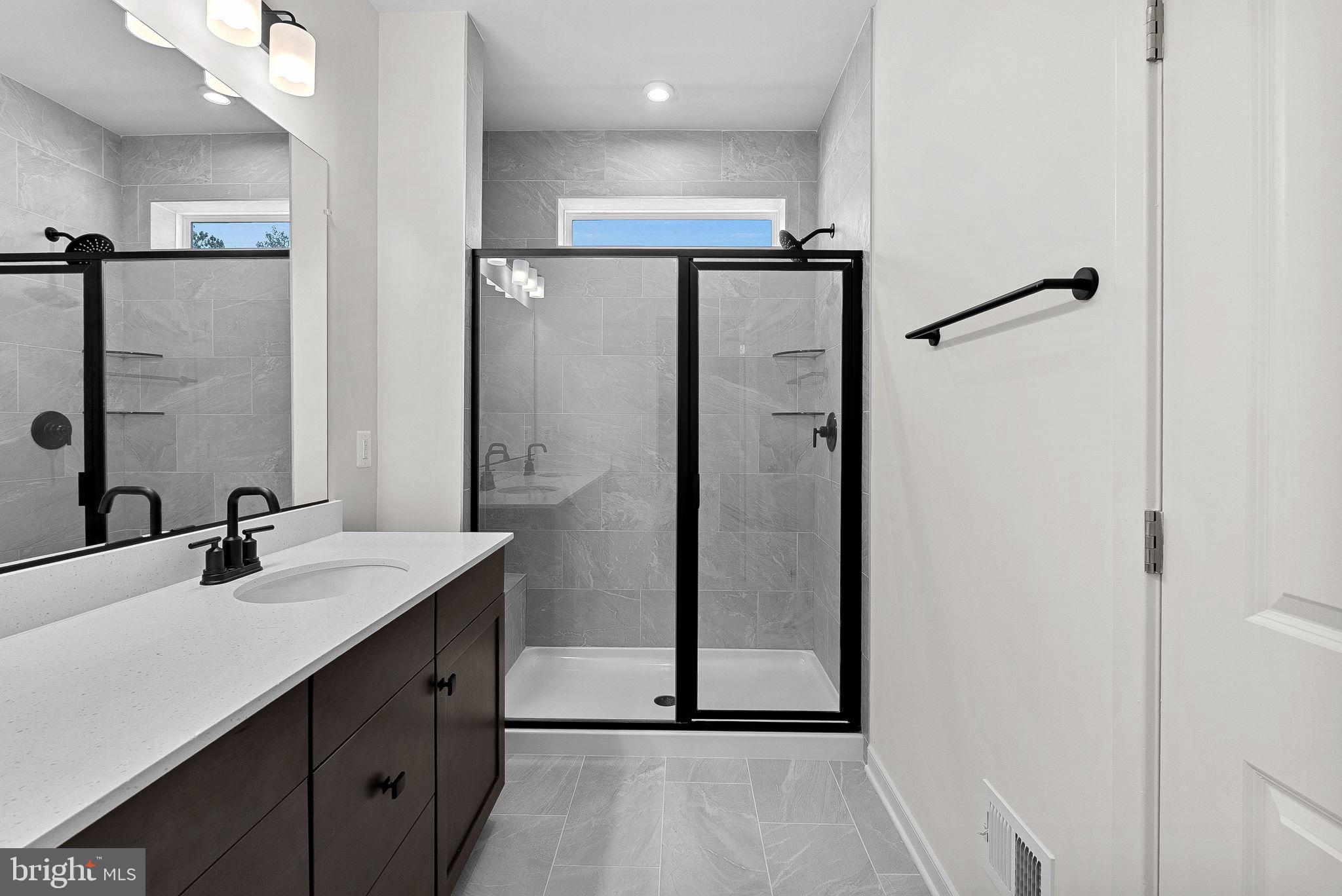 4151 Mountjoy Way Dumfries, VA 22026 - Photo 29 of 41 a bathroom with a double vanity sink mirror and shower