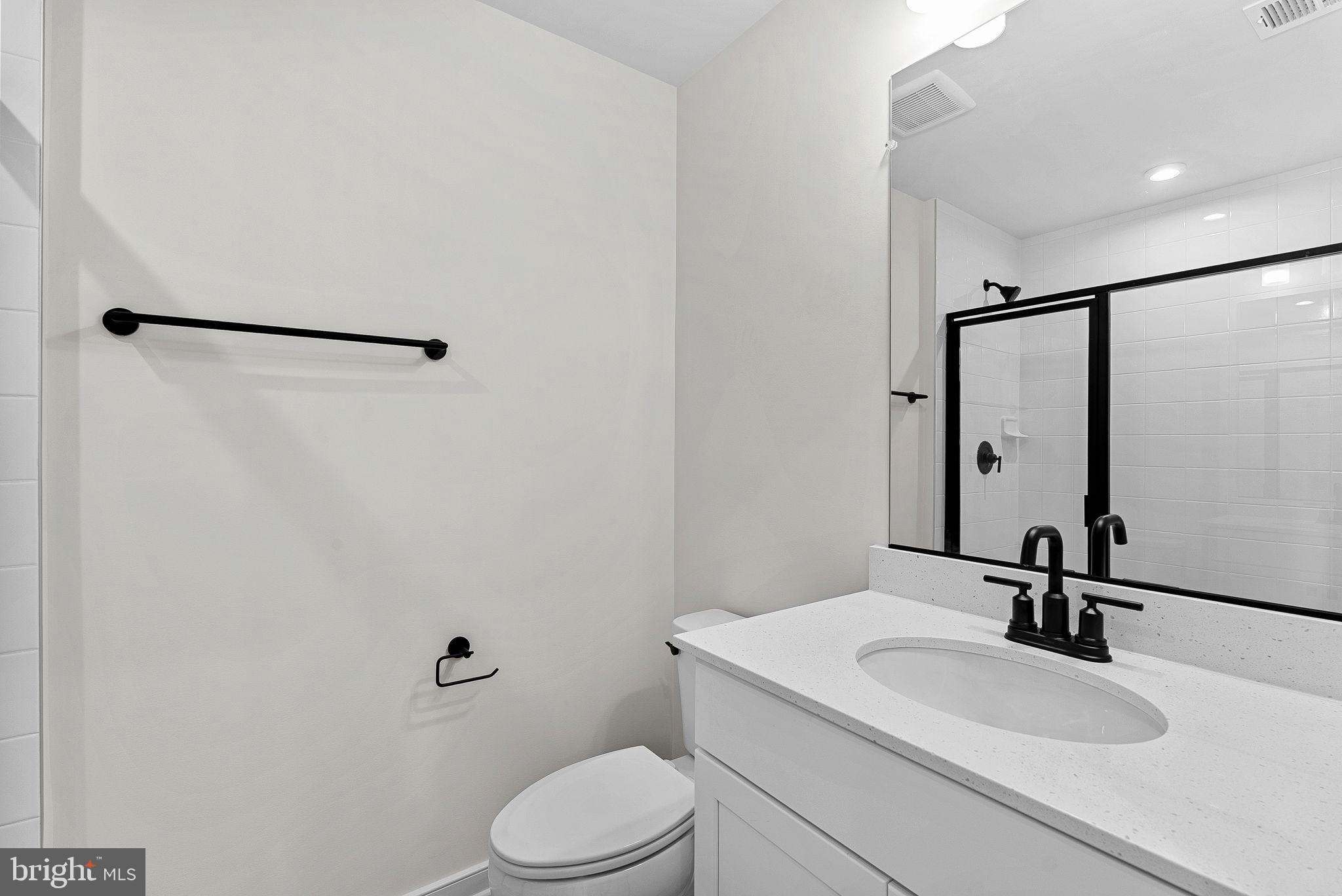 4151 Mountjoy Way Dumfries, VA 22026 - Photo 31 of 41 a bathroom with a sink toilet and mirror