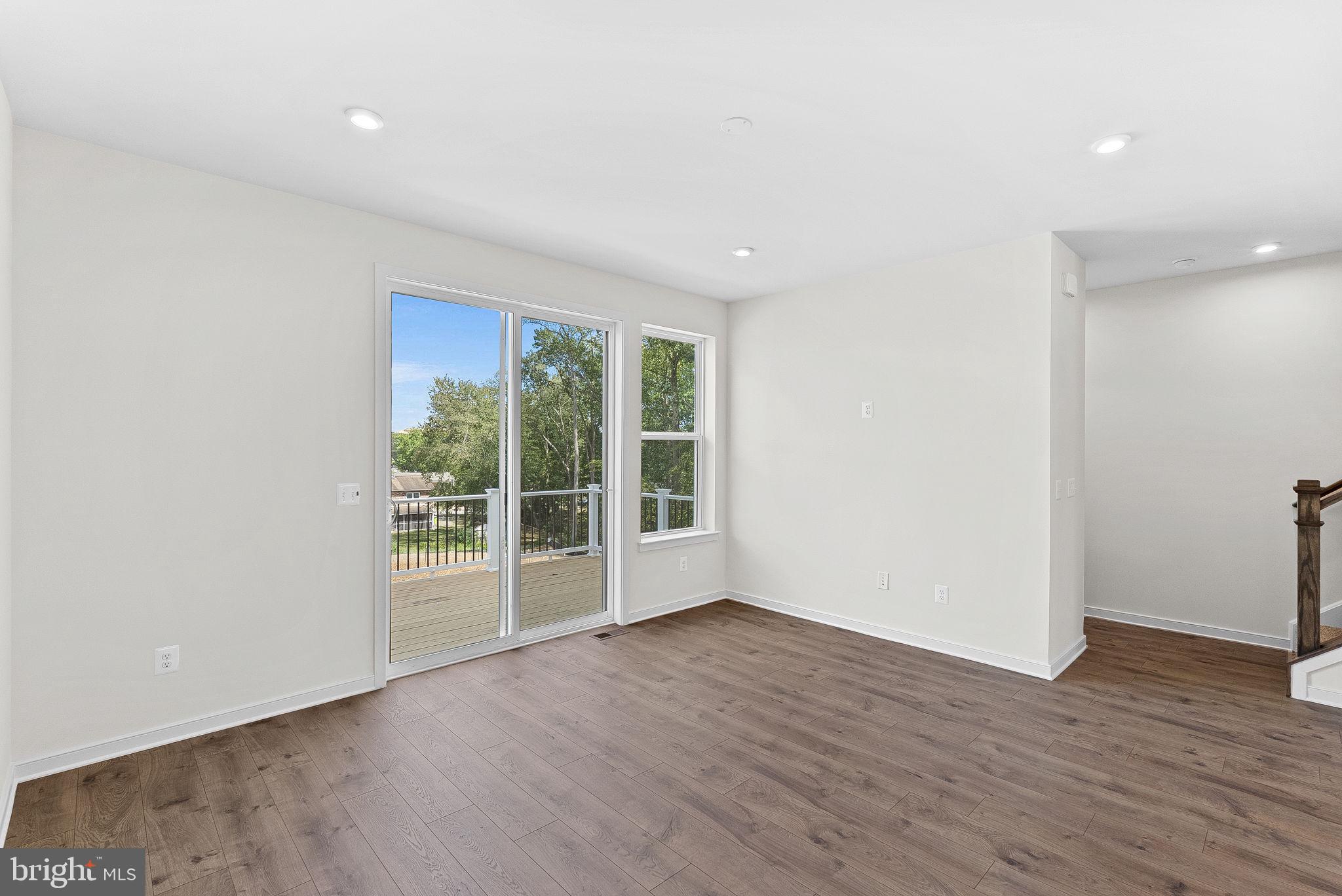 4151 Mountjoy Way Dumfries, VA 22026 - Photo 8 of 41 wooden floor in an empty room with a window
