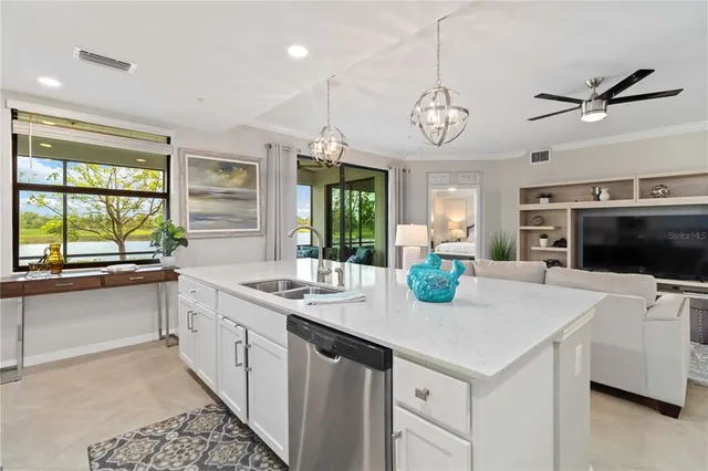 a dining room with furniture a chandelier and window