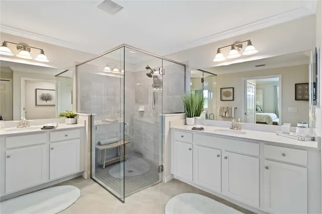 a view of a lake with houses in the back