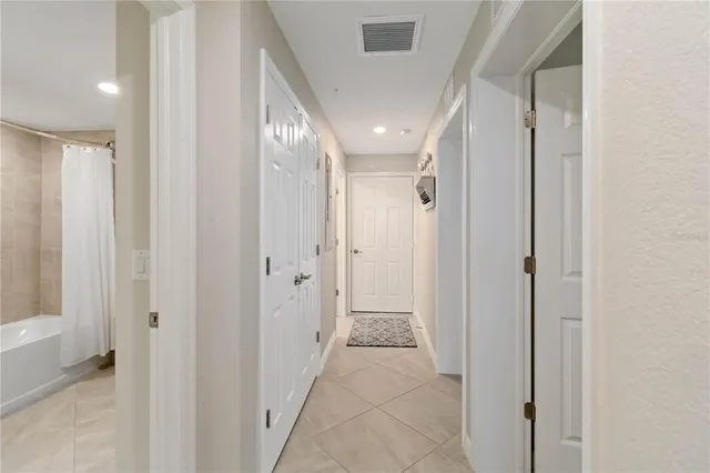 an aerial view of a house with outdoor space and lake view