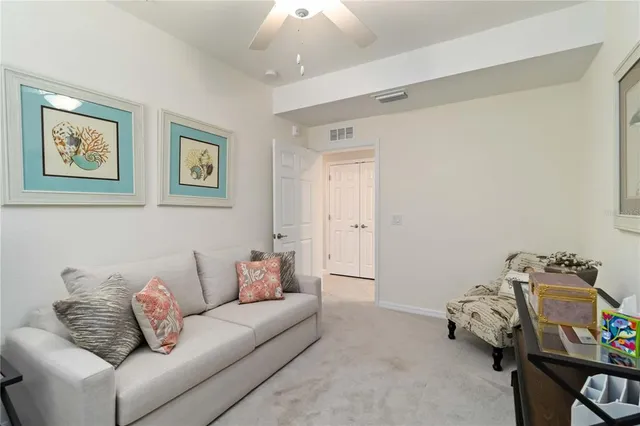 an aerial view of a house with a yard and a lake view