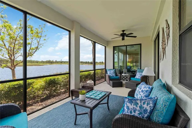 a view of a swimming pool with a table and chairs