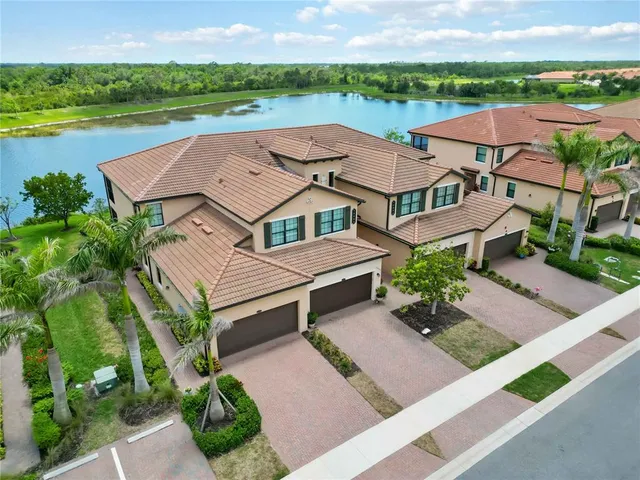 a view of a patio with a table and chairs under an umbrella