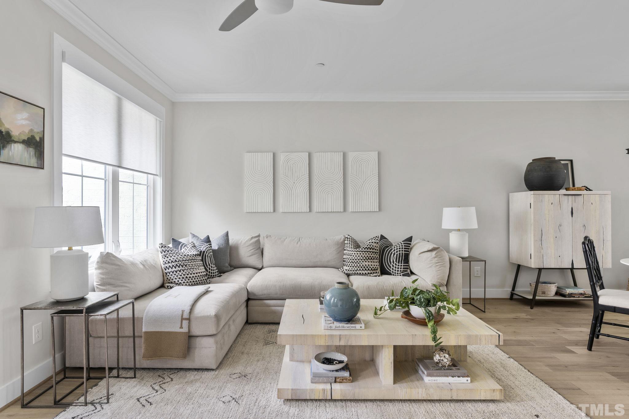 1610 Draper View Loop, Unit 104 Raleigh, NC 27608 - Photo 19 of 41 a living room with furniture and a rug