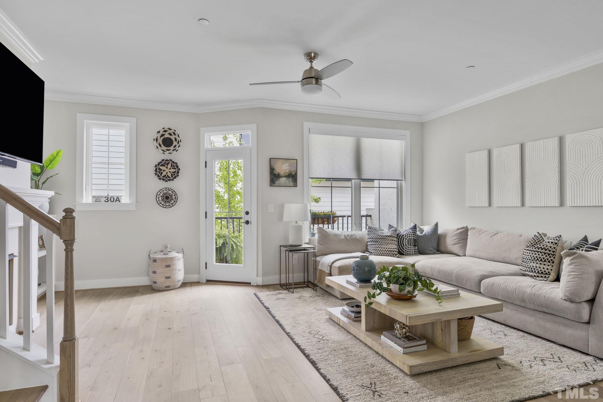 1610 Draper View Loop, Unit 104 Raleigh, NC 27608 - Photo 20 of 41 a living room with furniture and a flat screen tv