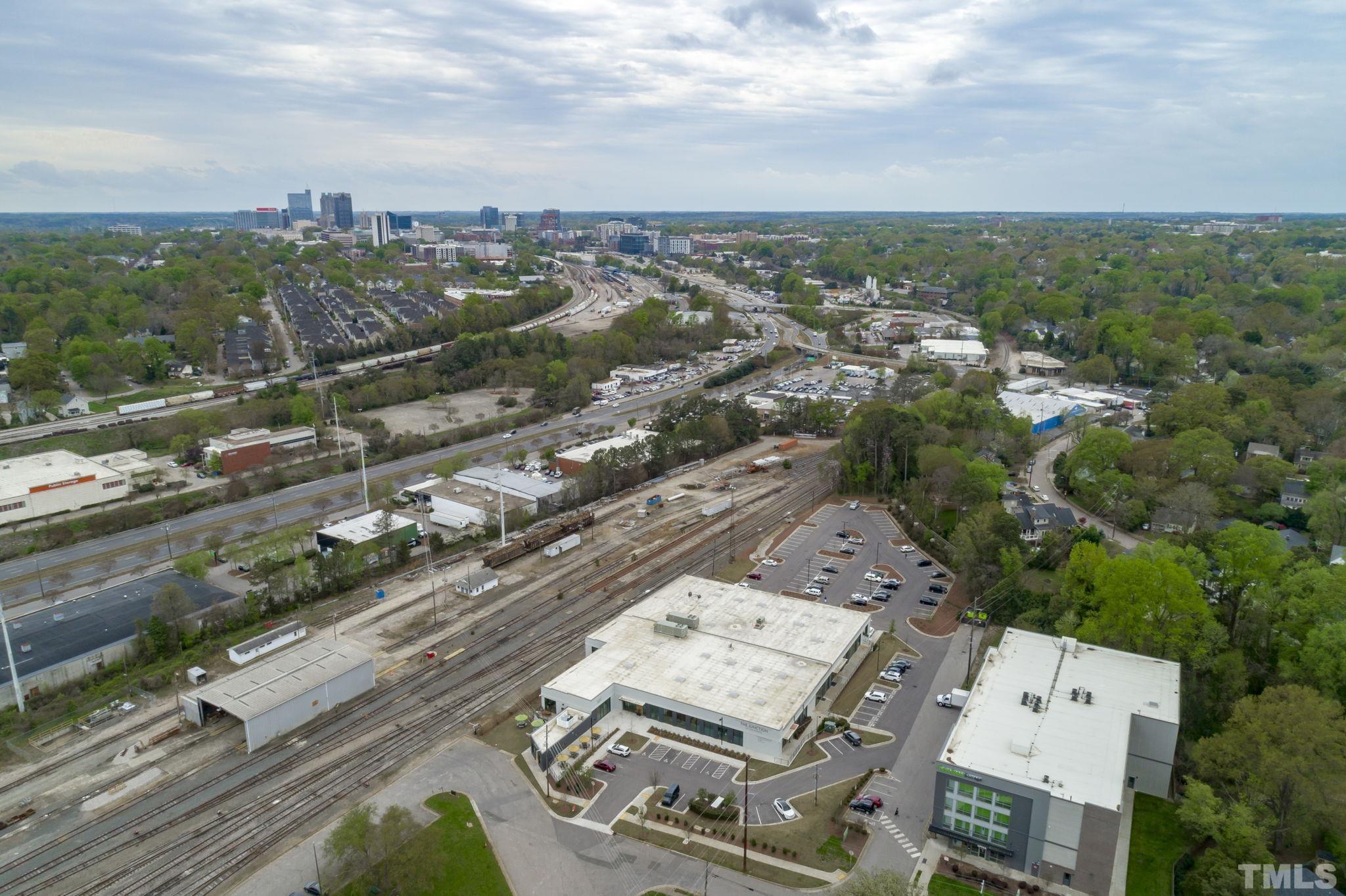 1610 Draper View Loop, Unit 104 Raleigh, NC 27608 - Photo 38 of 41 an aerial view of a city with lots of residential buildings