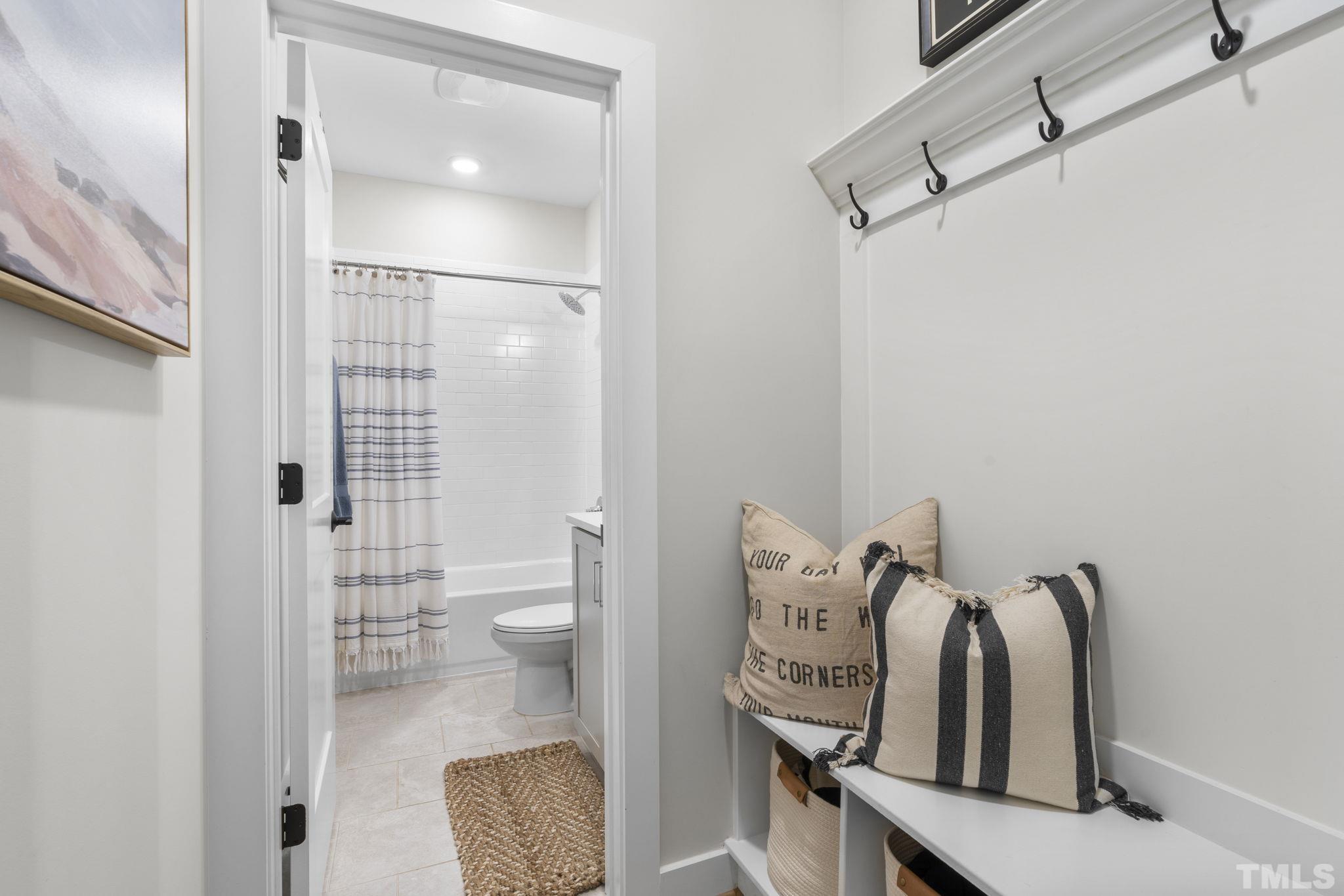 1610 Draper View Loop, Unit 104 Raleigh, NC 27608 - Photo 7 of 41 a view of a bathroom with a toilet and a shower