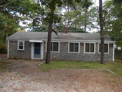 2 Robin Road West Yarmouth, MA 02673 - Photo 1 of 8 front view of a house with a yard