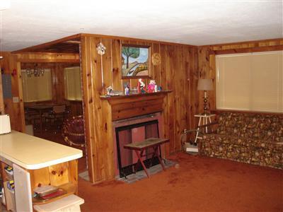 2 Robin Road West Yarmouth, MA 02673 - Photo 3 of 8 a room with furniture a mirror and a fireplace