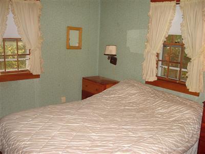 2 Robin Road West Yarmouth, MA 02673 - Photo 6 of 8 a bedroom with a bed and a window