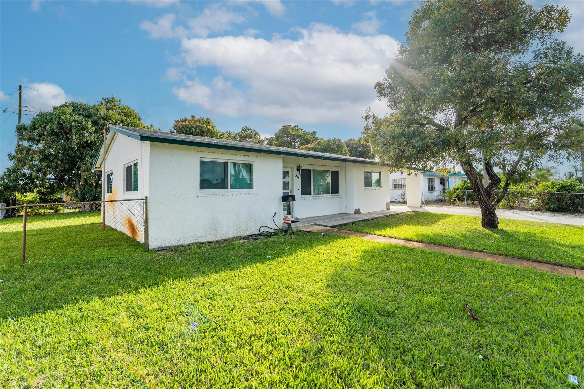 241 West 20th Street Riviera Beach, FL 33404 - Photo 3 of 43 Side Exterior View of Property.