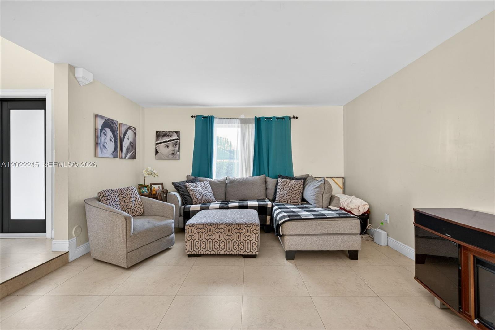 15530 Southwest 59th Street Miami, FL 33193 - Photo 8 of 58 a living room with furniture and a couch