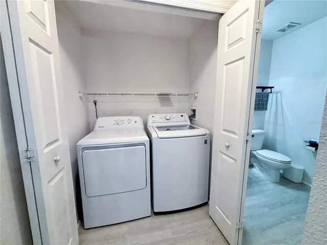 a view of bathroom with a toilet and a sink