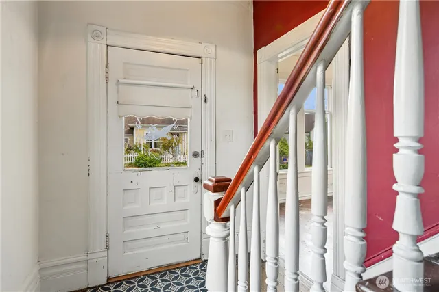 a bedroom with a bed and a ceiling fan