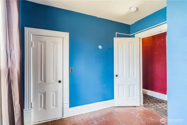 a room that has a bed and a table in it