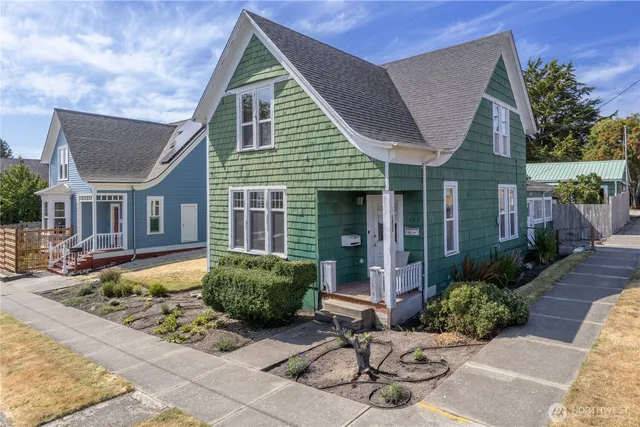 a view of a house with brick walls