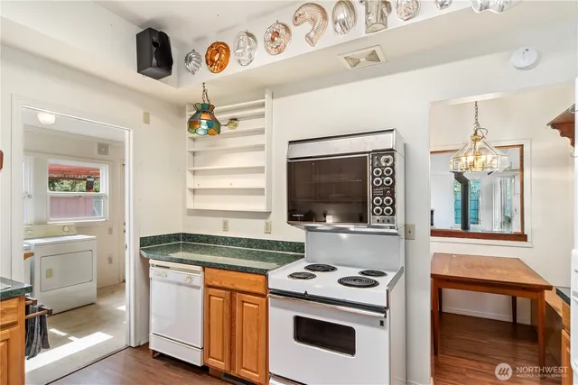 a kitchen with a stove and a microwave