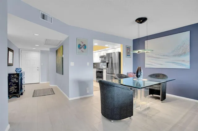 a view of a livingroom with furniture and window